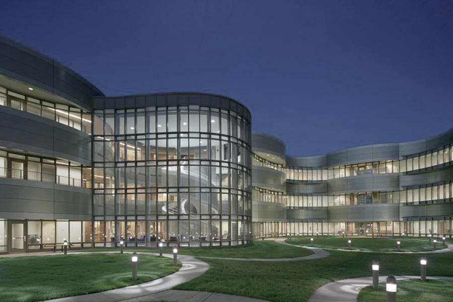 The exterior of NEIU's University Center of Lake County building at night