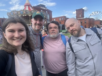 A photo of (from left to right) Patrycja Ściślewska, Aaron Schirmer, Piotr Bębas and Marcin M. Chrzanowski in Poland.