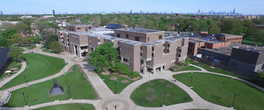 An aerial photo of NEIU's Main Campus with views of Bernard J. Brommel Hall and the University Commons with the Chicago skyline in the background.