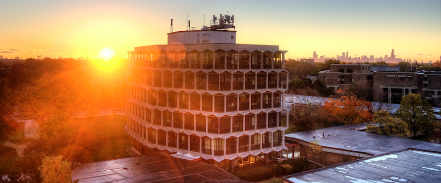 The sun rises behind the Sachs Administrative Building.