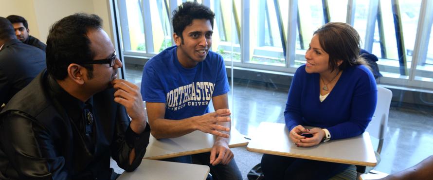 Two male and one female students in group discussion