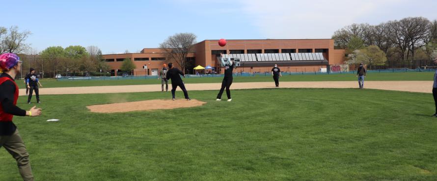 Student catching kickball.