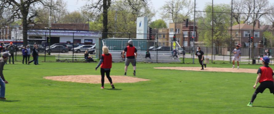 Faculty, Staff, and Students playing kickball.