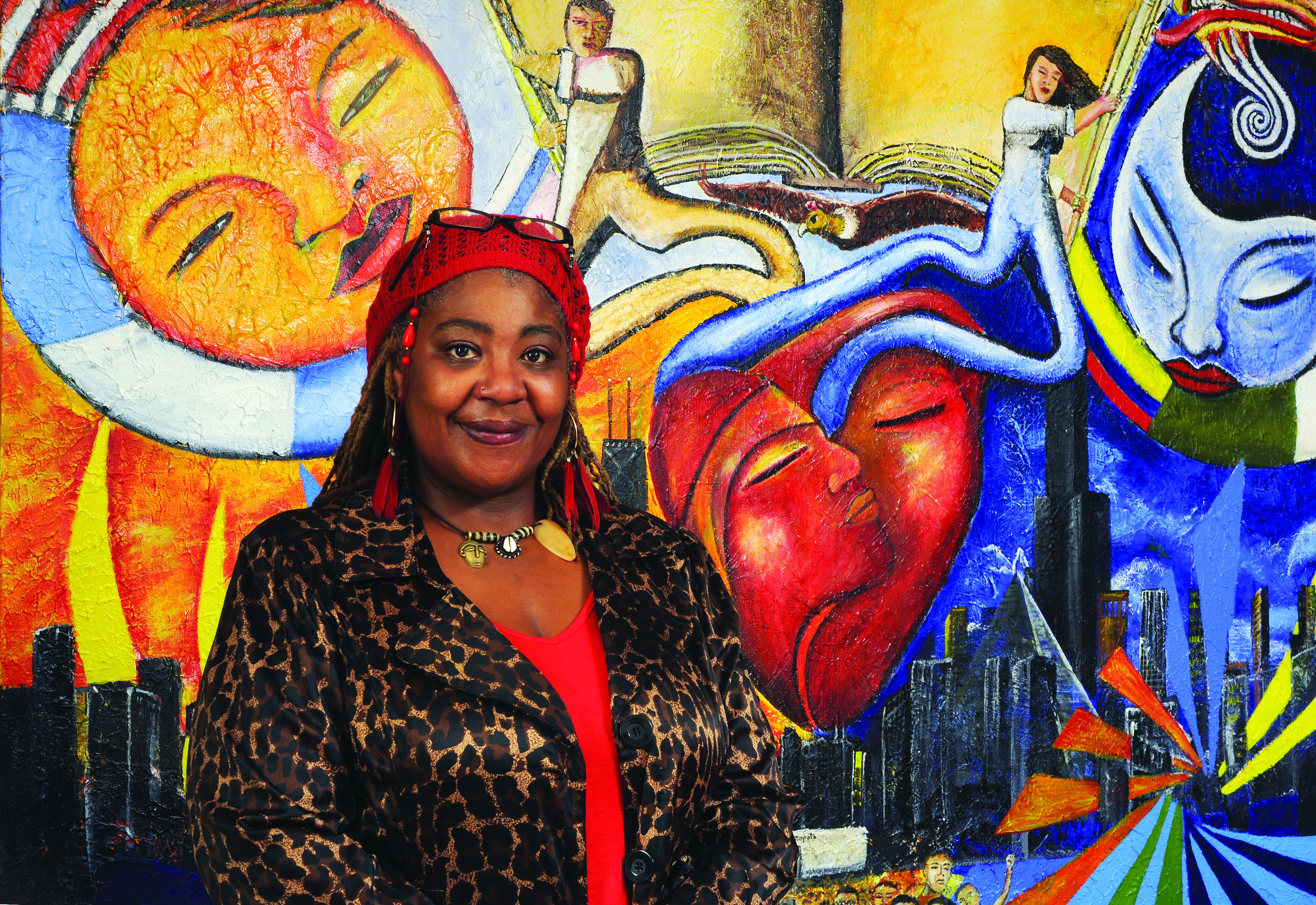 Rachel Hall, NEIUAA Internship Scholarship recipient, poses in front of a colorful mural.