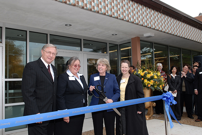 From left: Board of Trustees member Walter Dudycz, College of Business and Management Dean Amy Hietapelto, President Sharon Hahs and Karen Fredrickson of the Capital Development Board participate in the College of Business and Management ribbon-cutting ceremony.