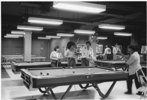 Students play pool in the basement game room of the Commuter Center in the late 1970s.