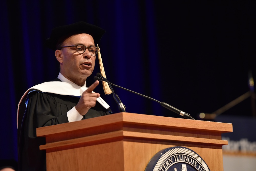 U.S. Congressman Luis V. Gutiérrez addresses the graduates from the podium during Commencement at UIC Pavilion on May 7, 2018.