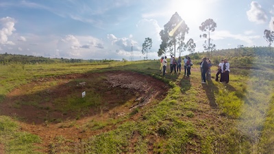 Members of the GHRAD Center with members of the TRC at the site of a mass grave near Gitega, Burundi.