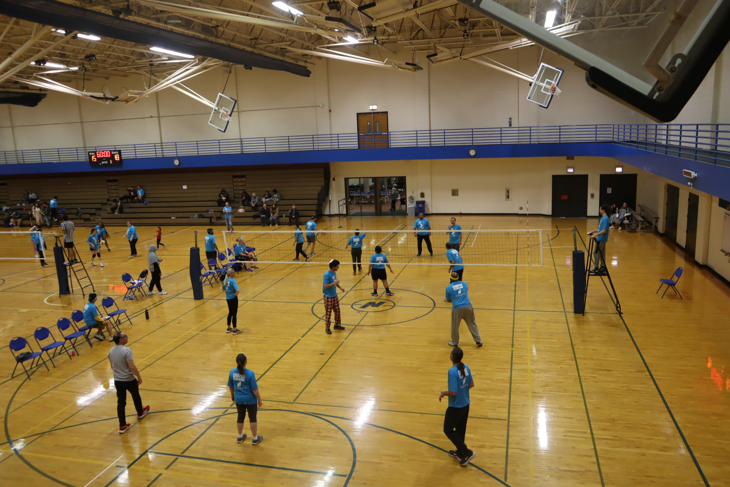 Students playing volleyball in the gym