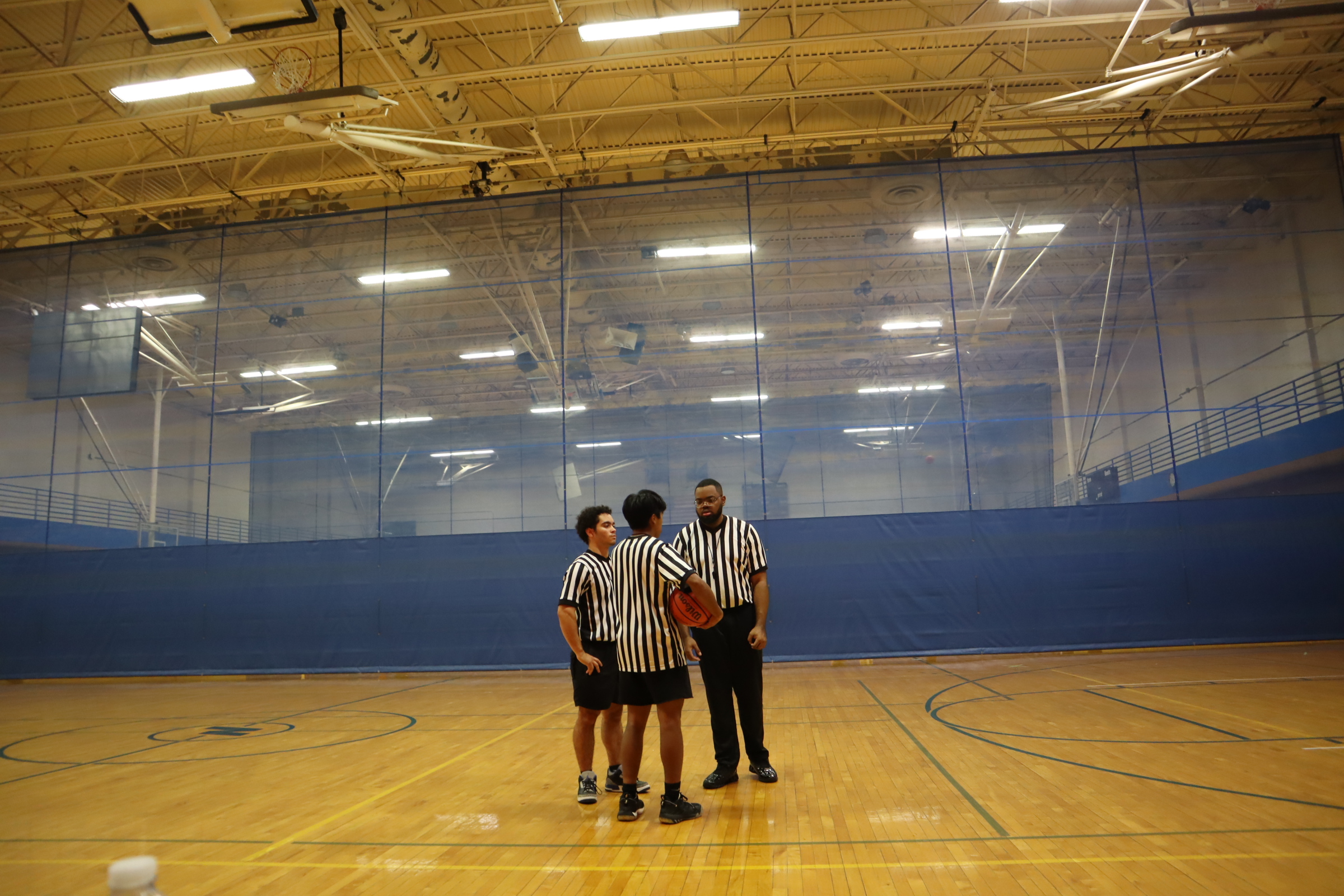Student referees discussing a call