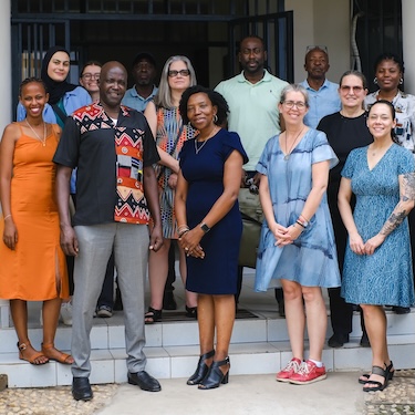 A photo of members of Northeastern's GHRAD Center with members of the Truth and Reconciliation Commission in Burundi, Africa. Photo by Viktor Gerasimovski.