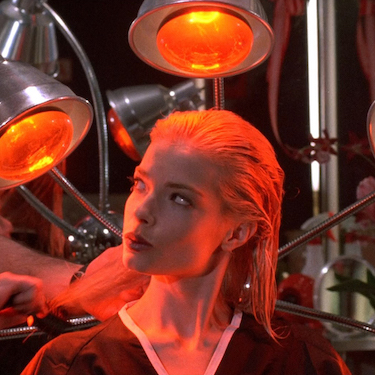 A still from the film "Special Effects." An actress sits in a chair with orange lights surrounding her. Photo courtesy of the Chicago Film Society. 