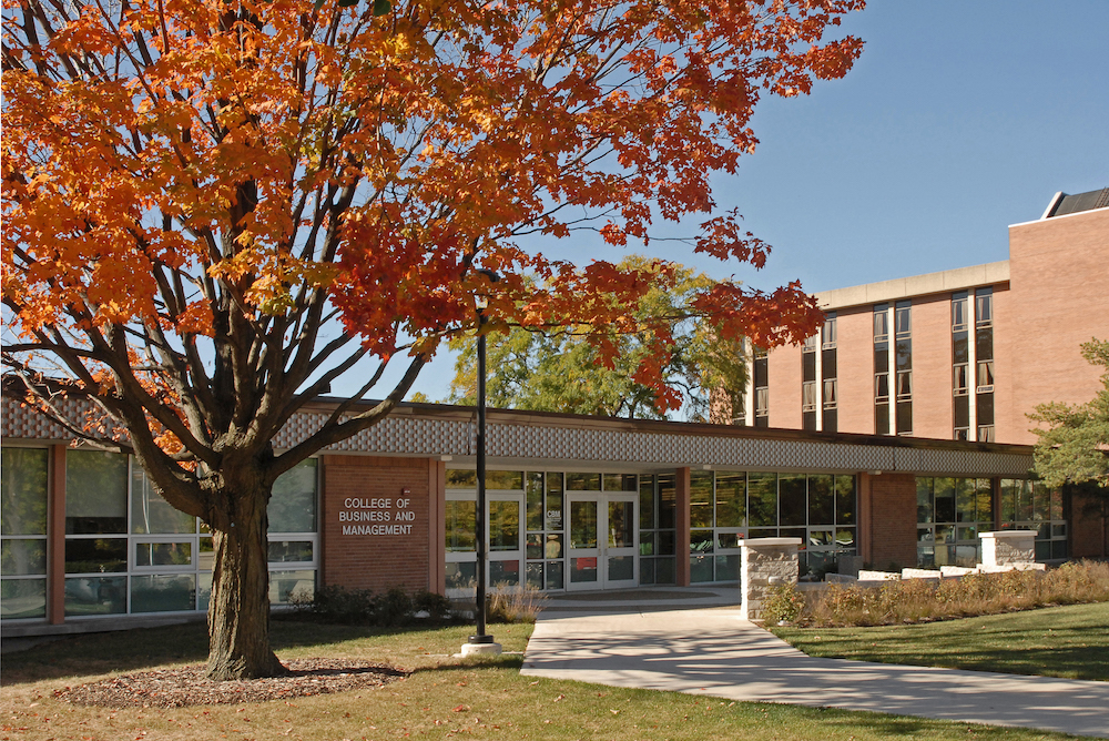 The northern exterior of the College of Business and Management building in autumn