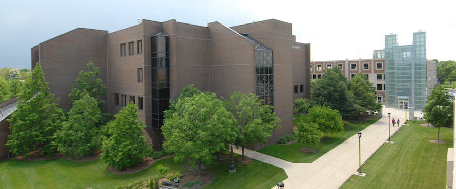 An elevated view of the north side of the Ronald Williams Library exterior with the Parking Facility in the background