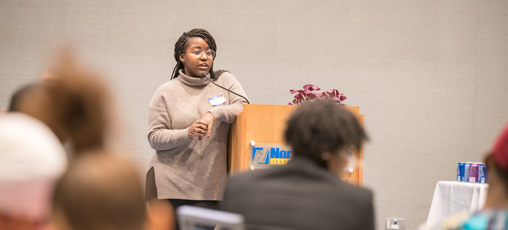 Photo of a woman presenting during a Black student networking meeting in Fall 2019.