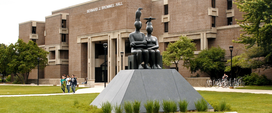 Photo of the exterior of Bernard Bommel Hall with the "Serenity" sculpture in the foreground.