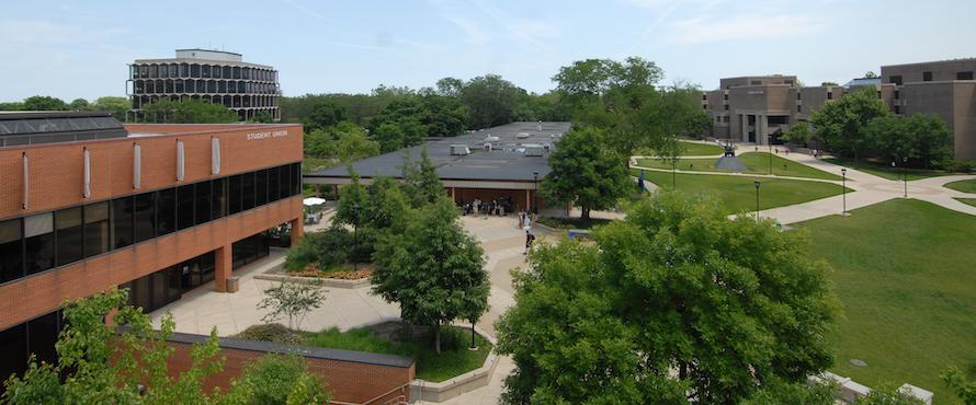 An aerial photo of NEIU's Main Campus, with the Student Union and C-Building on the left and Bernard J. Brommel Hall on the right.