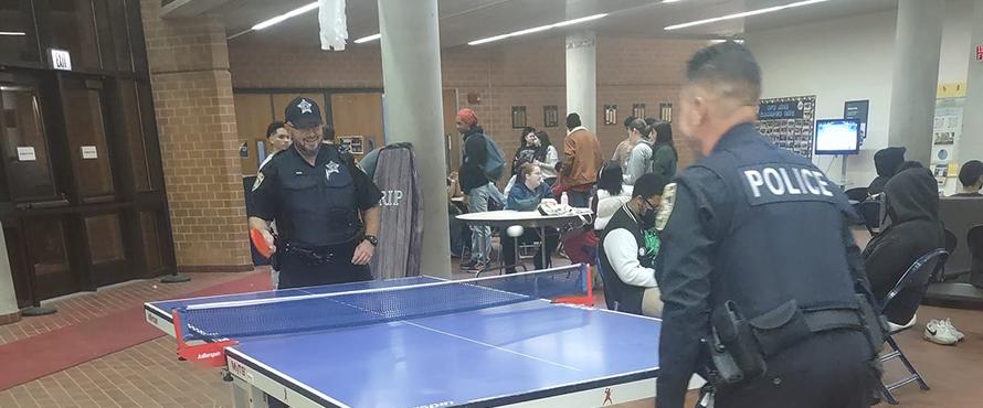 Officers playing table tennis.